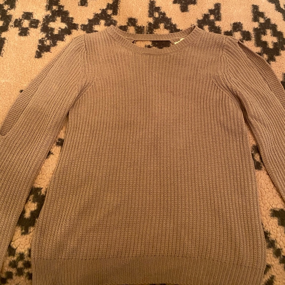 Light purple sweater with design on the back